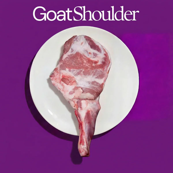 Raw goat shoulder on a white plate with 'Goat Shoulder' text against a purple background