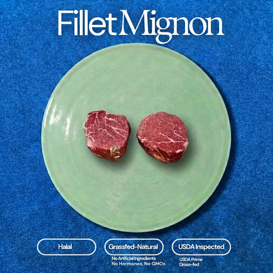 Two raw, marbled fillet mignon steaks on a light green ceramic plate are centered on a deep blue textured background, featuring white text 'Fillet Mignon' at the top and labels for Halal, Grassfed-Natural, and USDA Inspected at the bottom