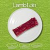 A vibrant red raw lamb loin on a white plate against a textured green background with Lamb Loin title and descriptive labels Halal Natural and Pasture Raised