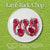 A product image showing four vibrant raw lamb rack chops with red meat and white bones arranged on a white plate against a textured green background highlighting Halal Natural Pasture Raised qualities