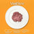 A top-down view of raw diced veal stew meat piled on a white plate against a vibrant orange background featuring Halal Natural-Milkfed and Pasture Raised labels