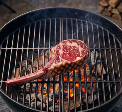 Steak on a grill with flames and smoke