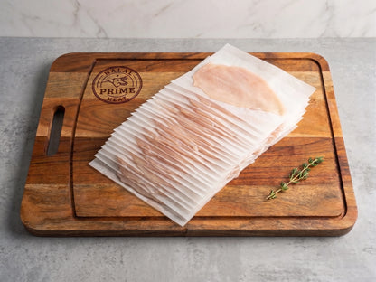 2lb of chin cut chicken on a cutting board