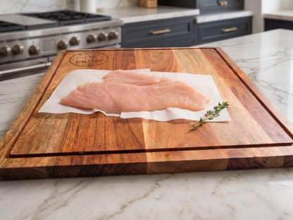 Thin sliced chicken on a cutting board